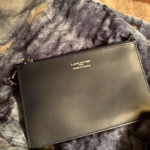 Hand held leather clutch.